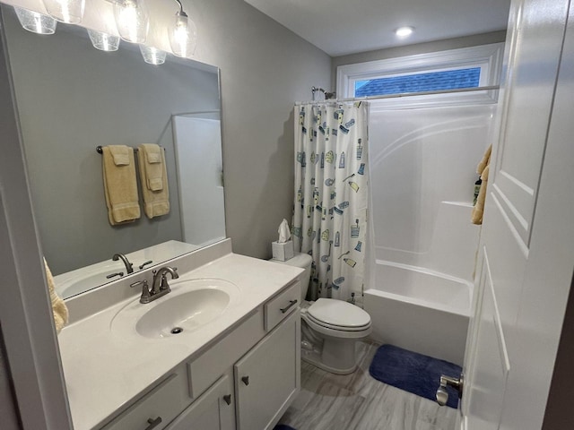 full bathroom with shower / tub combo with curtain, vanity, and toilet