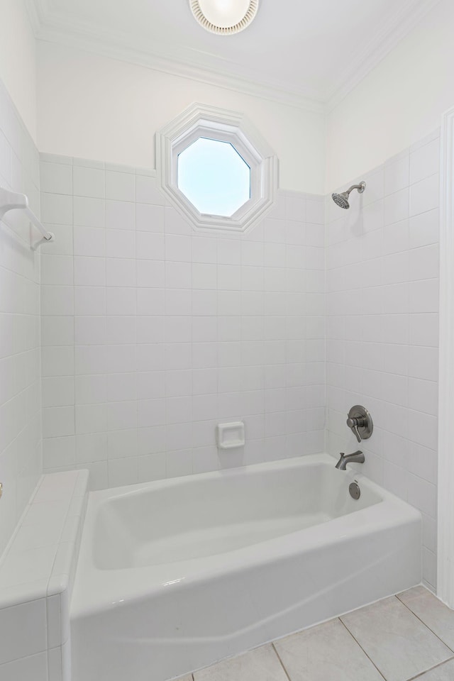 bathroom with ornamental molding, tile patterned floors, and tiled shower / bath