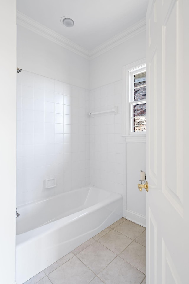 bathroom featuring crown molding, tiled shower / bath combo, and tile patterned flooring