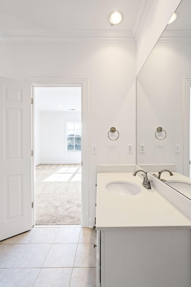 bathroom with ornamental molding, tile patterned flooring, and vanity