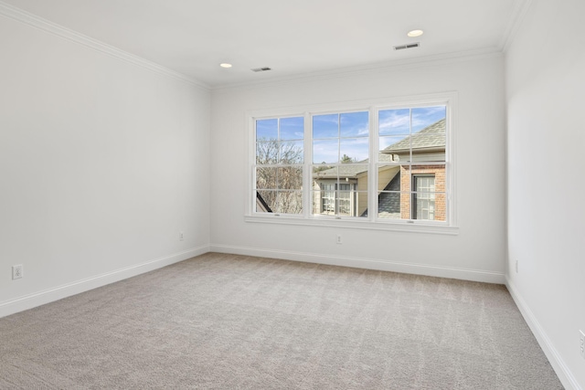 unfurnished room with crown molding, carpet, and a healthy amount of sunlight