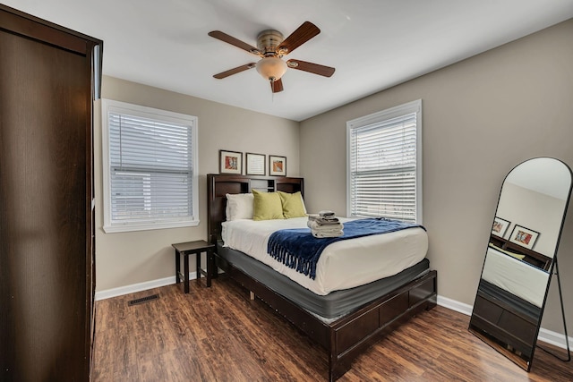 bedroom featuring dark wood-type flooring and ceiling fan