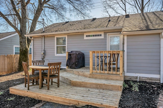 wooden deck with grilling area