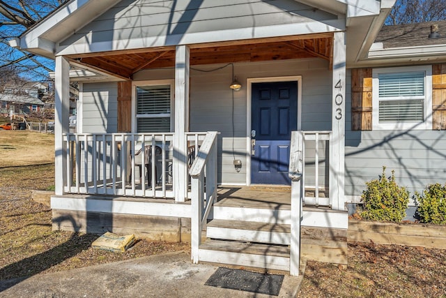 doorway to property featuring covered porch