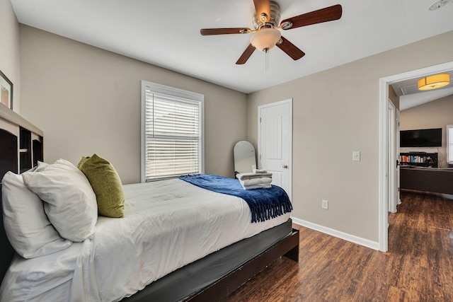 bedroom with ceiling fan and dark hardwood / wood-style flooring