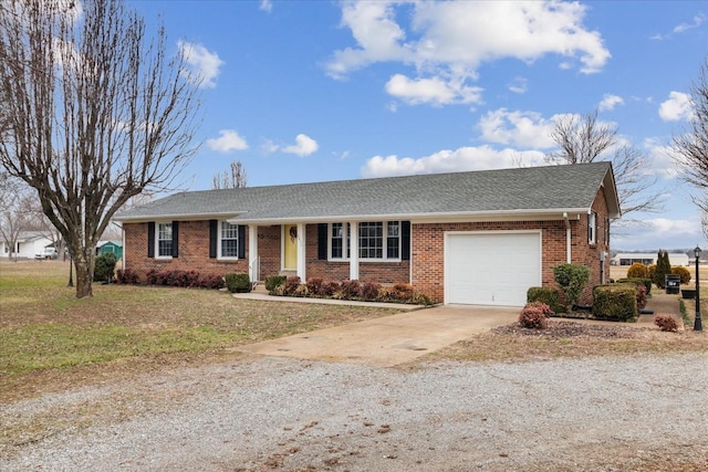 single story home with a garage and a front yard