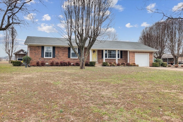 ranch-style home with a garage and a front yard