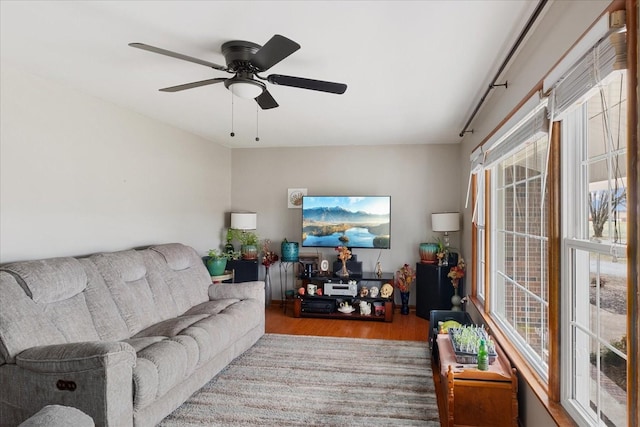 living room featuring ceiling fan and light wood-type flooring