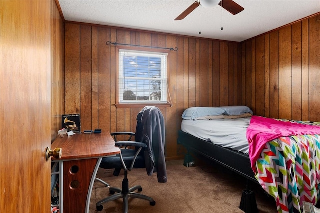 bedroom featuring carpet and wood walls