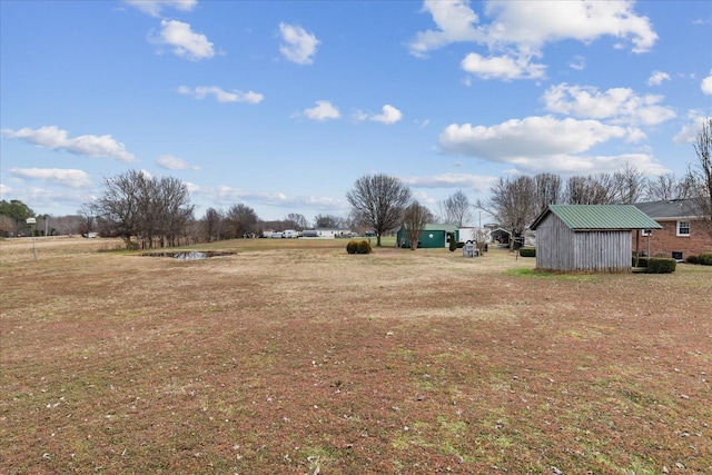 view of yard with a rural view