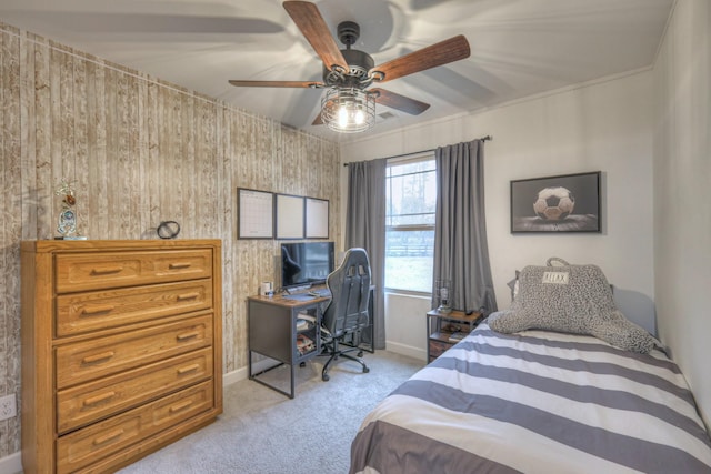 bedroom with baseboards, a ceiling fan, and light colored carpet