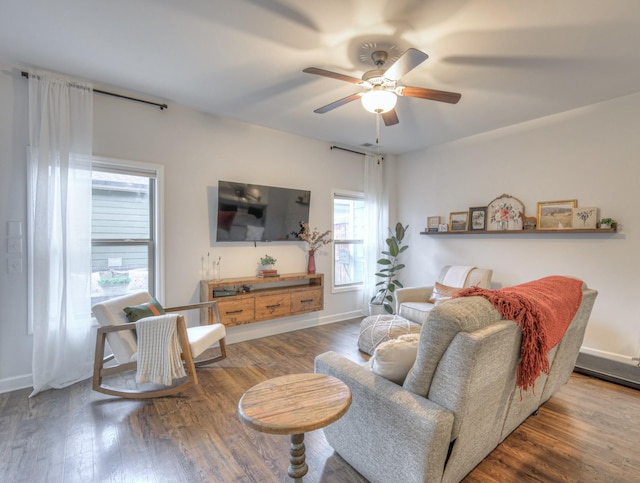 living room with ceiling fan and hardwood / wood-style floors