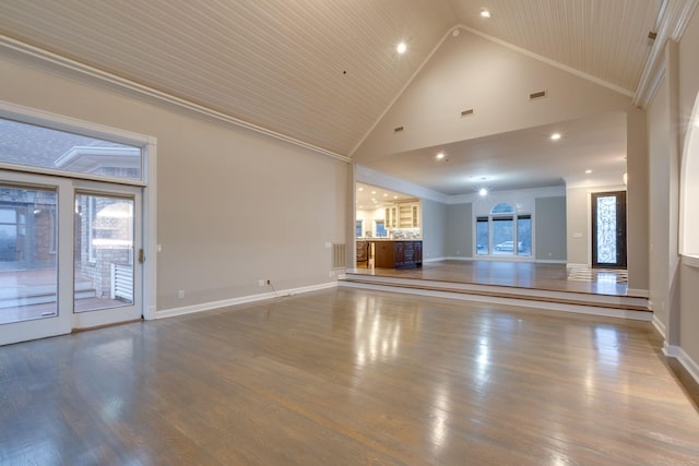 unfurnished living room with high vaulted ceiling, hardwood / wood-style flooring, and ornamental molding