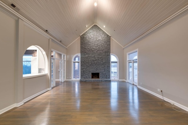 unfurnished living room with dark wood-type flooring, ornamental molding, and high vaulted ceiling