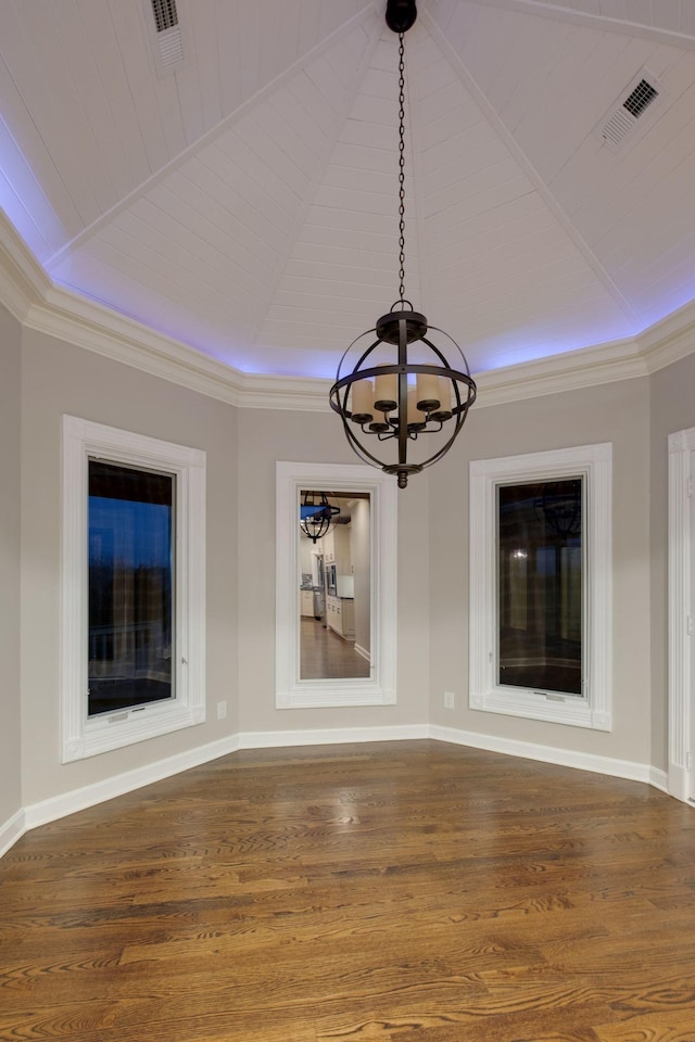 interior space with vaulted ceiling, hardwood / wood-style floors, and a notable chandelier