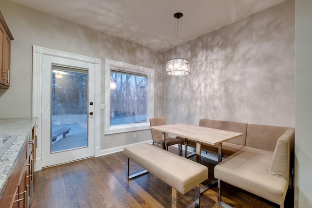 dining room with dark hardwood / wood-style floors