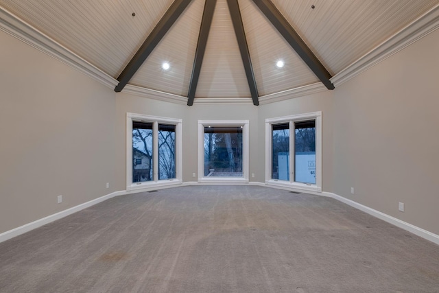 empty room with carpet floors, high vaulted ceiling, and beamed ceiling