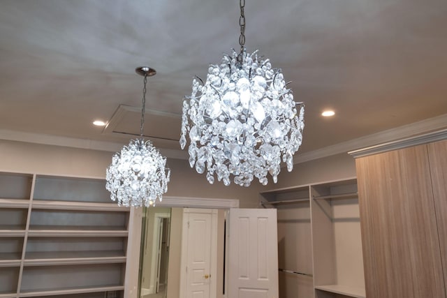 walk in closet featuring a notable chandelier