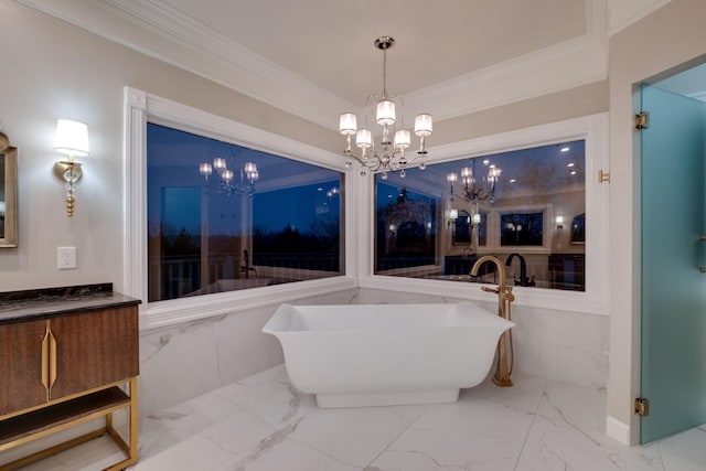 bathroom featuring an inviting chandelier, a tub to relax in, and ornamental molding