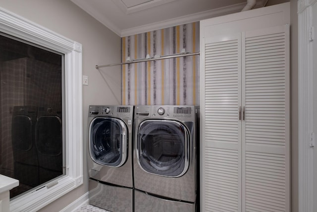 clothes washing area featuring crown molding and independent washer and dryer