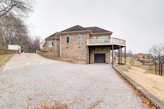 exterior space featuring a garage and a deck