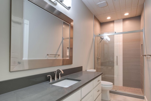 bathroom featuring vanity, an enclosed shower, tile patterned floors, and toilet