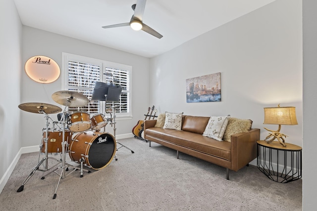 interior space with ceiling fan and carpet