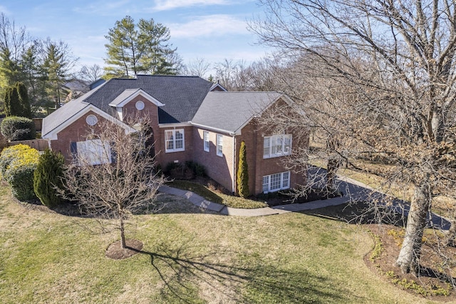 view of side of property with a yard