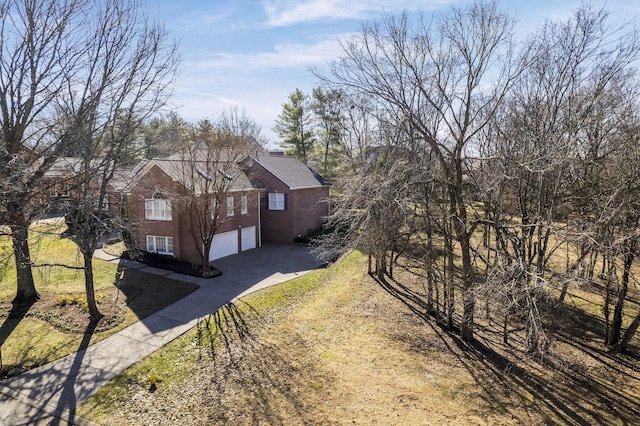 view of home's exterior with a yard and a garage