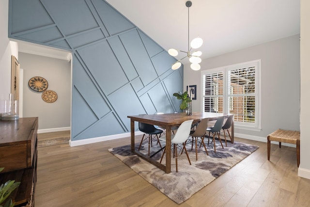 dining room with an inviting chandelier and hardwood / wood-style flooring