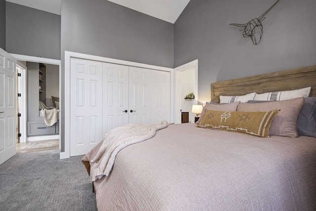 carpeted bedroom with high vaulted ceiling and a closet