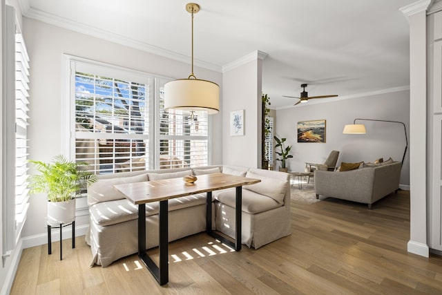 dining room with breakfast area, ceiling fan, crown molding, and hardwood / wood-style floors