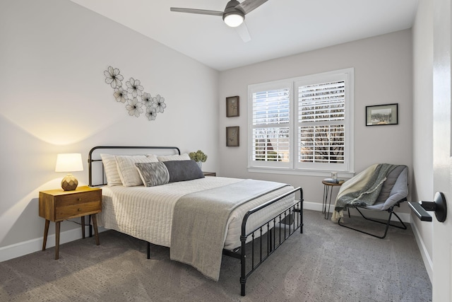 bedroom with ceiling fan and dark carpet