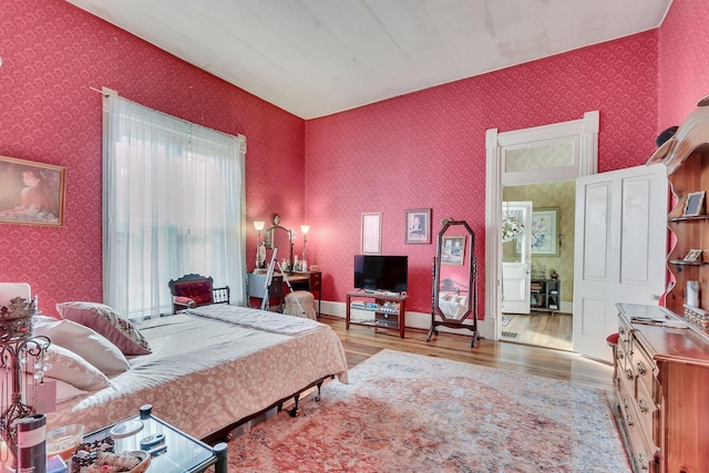 bedroom with light hardwood / wood-style flooring