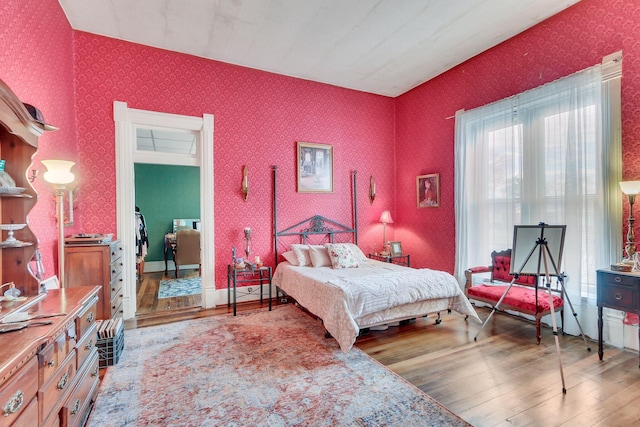 bedroom with wood-type flooring