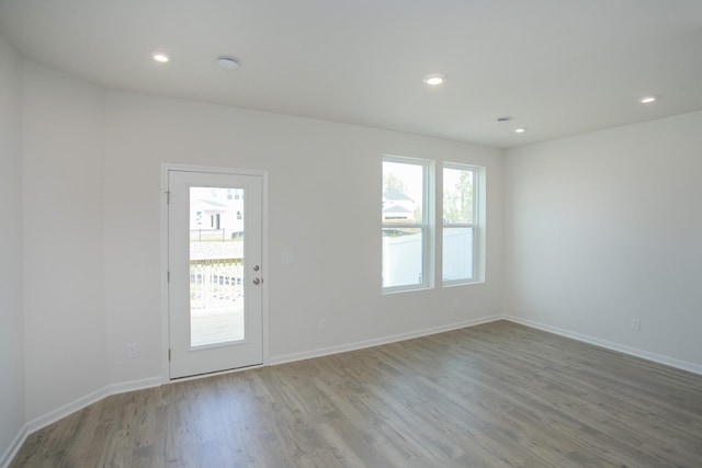 spare room with light hardwood / wood-style floors