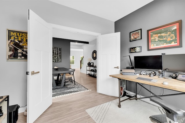 office with light hardwood / wood-style floors