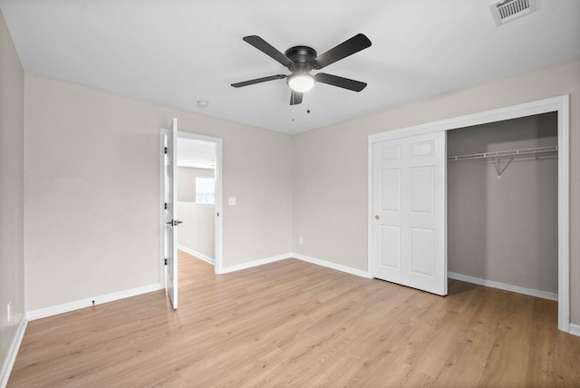 unfurnished bedroom featuring a closet, ceiling fan, and light hardwood / wood-style flooring