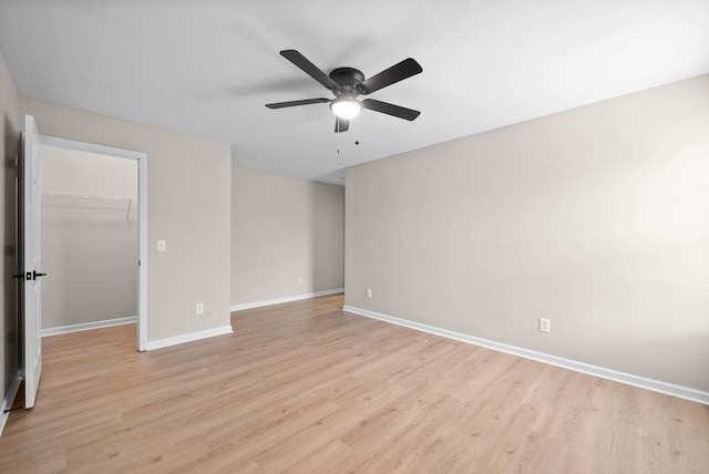 spare room featuring ceiling fan and light wood-type flooring