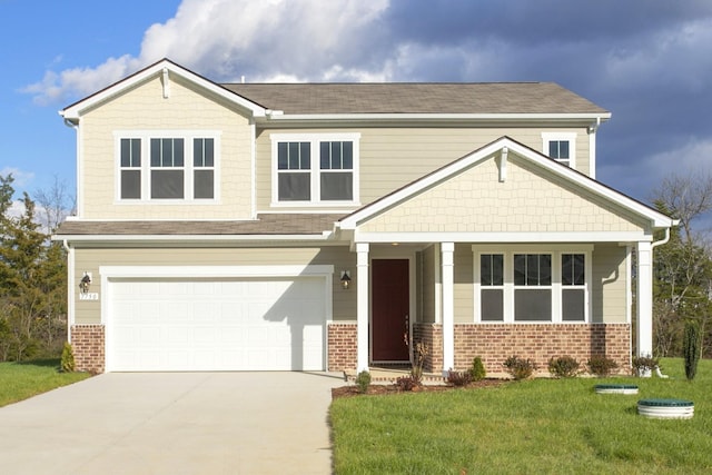 craftsman inspired home with a garage and a front yard