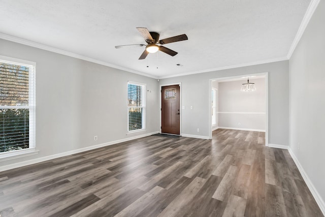 unfurnished room with crown molding, dark hardwood / wood-style floors, ceiling fan with notable chandelier, and a textured ceiling