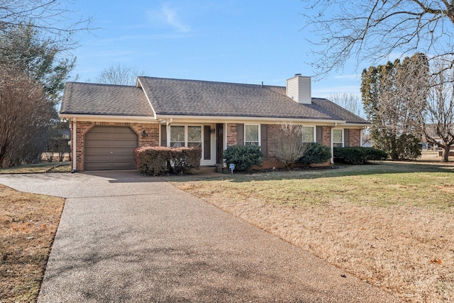 ranch-style house featuring a garage and a front yard