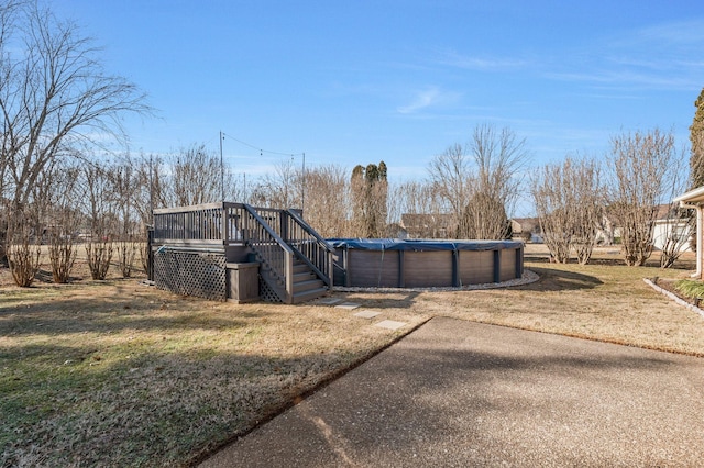 view of yard featuring a swimming pool side deck