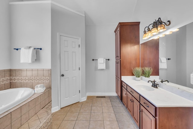 bathroom featuring a relaxing tiled tub, vanity, and tile patterned floors