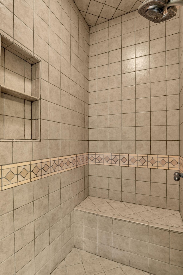 bathroom with tiled shower