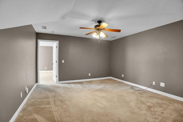 empty room featuring light carpet and ceiling fan