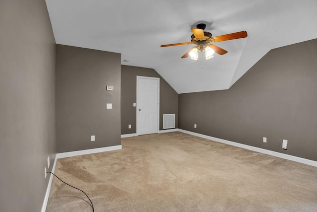 bonus room featuring vaulted ceiling, carpet, and ceiling fan