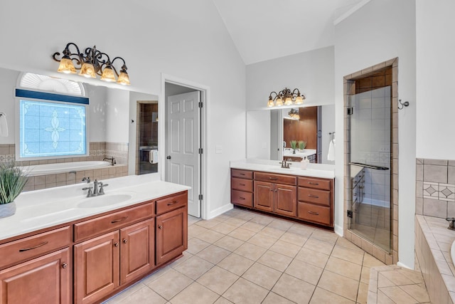 bathroom with tile patterned floors, plus walk in shower, vaulted ceiling, and vanity