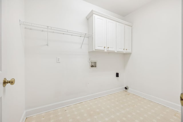 laundry room featuring cabinets, hookup for a washing machine, and electric dryer hookup