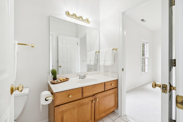 bathroom with vanity and toilet